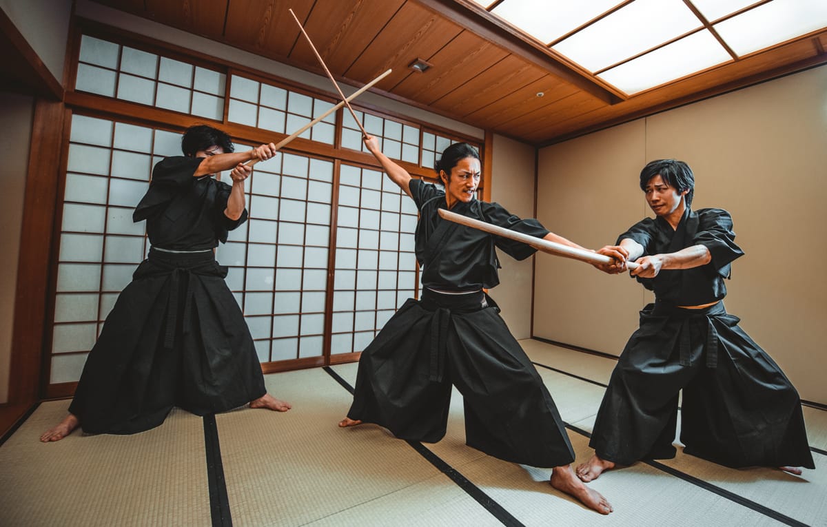 A traditional dojo interior with weapons on the wall